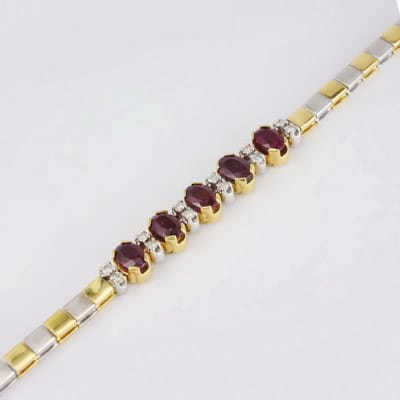 Золотой двухцветный браслет 750° с рубинами и бриллиантами Амира